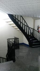 a black staircase in a room with a ceiling at Parque Hotel in Rio de Janeiro +18 photos
