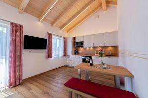 a kitchen with a wooden table in a room at Ferienwohnung Ronja 