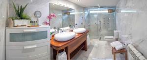 a bathroom with a sink and a shower and a toilet at OVIEDO REAL Spa in Oviedo +37 photos
