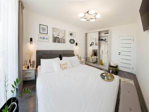 Posteľ alebo postele v izbe v ubytovaní Sweet Home Avalon