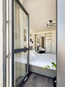 Posteľ alebo postele v izbe v ubytovaní Sweet Home Avalon