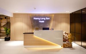 a lobby with a reception desk with a happy long sun hotel at Hoang Long Son 2 in Ho Chi Minh City