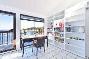 a home office with a desk and a window at Sunshine Shores in Morisset East