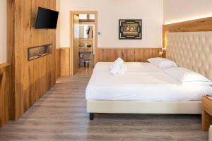 Postel nebo postele na pokoji v ubytování Hotel Du Parc