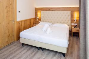 Postel nebo postele na pokoji v ubytování Hotel Du Parc