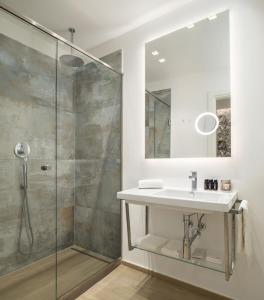 a bathroom with a sink and a shower at One Design Hotel in Rimini