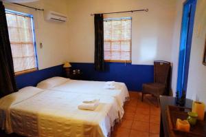 Een bed of bedden in een kamer bij Caribbean Chillout Apartments