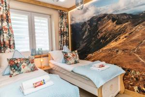 Posteľ alebo postele v izbe v ubytovaní Bunia w Zakopanem z jacuzzi