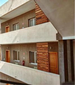 an external view of a building with windows at Praia Capital Residence Aparthotel in Praia