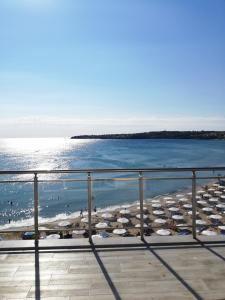 a view of a beach with umbrellas and the ocean at Hotel GAIA in Sozopol
