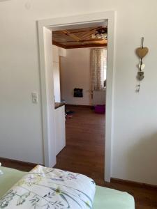 a room with a bed and a room with a hallway at Ferienwohnung Alpennestchen Tschagguns in Tschagguns