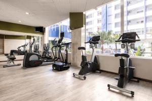 a gym with a bunch of treadmills and exercise bikes at Catalonia Punta del Rey in Candelaria