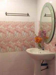 a bathroom with a sink and a mirror at Life&Love Resort in Ban Khlong Son