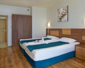 Paradise Beach Residence - Ultra All Inclusive tesisinde bir odada yatak veya yataklar