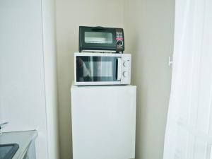 Kuchyň nebo kuchyňský kout v ubytování (A5)NEW OPEN☆中心エリアへ好アクセス　格安＆美室で快適空間　サービスアパ―トメントSAPPORO南8条A5