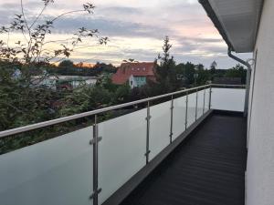 a balcony with a view of a city at Penthaus in Soltau