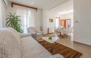 a living room with a couch and a table at Holiday House Karla Valentina in Škropeti