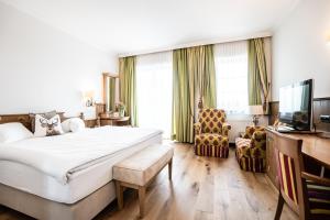 Ένα ή περισσότερα κρεβάτια σε δωμάτιο στο Hotel Hubertushof