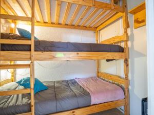 a couple of bunk beds in a room at Apartment La Roche Blanche-11 by Interhome in Val Thorens