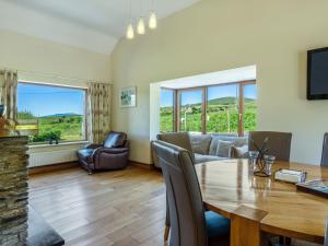 a living room with a table and a couch at Holiday Home Cuascrome by Interhome in Cahersiveen