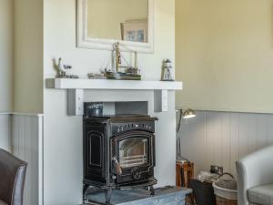 an old fashioned stove in a living room at Holiday Home Cuascrome by Interhome in Cahersiveen