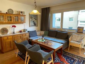a living room with a couch and a table at Apartment Sollereder by Interhome in Brixen im Thale