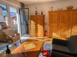 a living room with a couch and a table at Apartment Sollereder by Interhome in Brixen im Thale +49 photos