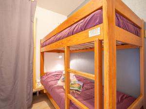 a bunk bed in a room with a bunk bedutenewayewayangering at Apartment Arcelle-11 by Interhome in Val Thorens