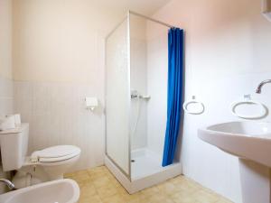 a bathroom with a shower and a toilet and a sink at Apartment Thalassa by Interhome in Calvi