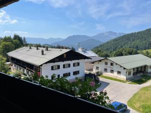 an aerial view of a house with mountains in the background at Apartment Buchenhöhe-1 by Interhome in Resten