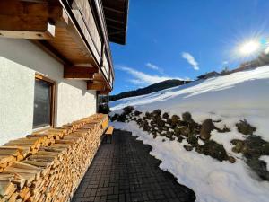 a balcony of a building with snow on the ground at Apartment Karwendel by Interhome in Oberau