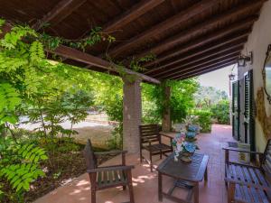 a patio with chairs and a table on a patio at Holiday Home Fonte del Ceppo 1 by Interhome in Tortoreto Lido