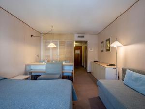 a room with a kitchen and a table and chairs at Apartment Universo-1 by Interhome in Pré-Saint-Didier