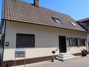 a white house with a black roof at Holiday Home Roth by Interhome in Neuried