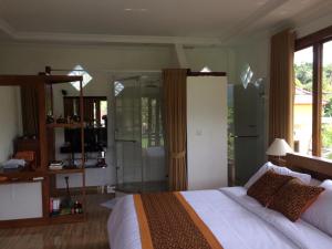 The Aroma Villa Munduk客房内的一张或多张床位