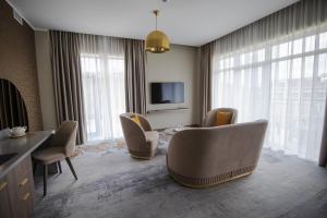 TV a/nebo společenská místnost v ubytování Mineral SPA Draugystė