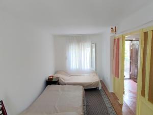 Postel nebo postele na pokoji v ubytování Apartman Sole