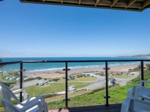 a view of the beach from the balcony of a beach house at Apartment Flat 11 Clifton Court by Interhome in Croyde