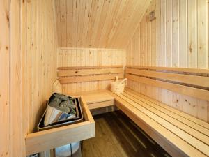 a wooden sauna with a tub in it at Holiday Home Loch Ness House by Interhome in Drumnadrochit