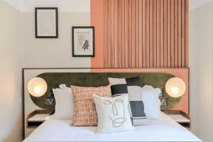 a bedroom with a large bed with white pillows at Your Apartment I Arabica House in Bristol +46 photos