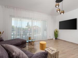 Telewizja i/lub zestaw kina domowego w obiekcie Holiday Home Villa Palma by Interhome