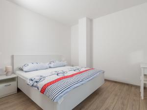 Łóżko lub łóżka w pokoju w obiekcie Holiday Home Villa Palma by Interhome