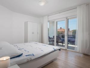 Łóżko lub łóżka w pokoju w obiekcie Holiday Home Villa Palma by Interhome