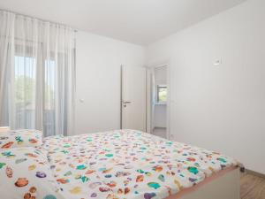 Łóżko lub łóżka w pokoju w obiekcie Holiday Home Villa Palma by Interhome