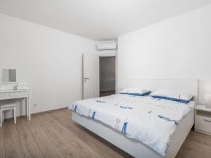 Łóżko lub łóżka w pokoju w obiekcie Holiday Home Villa Palma by Interhome