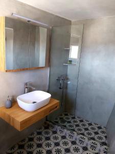 a bathroom with a sink and a shower at Rosolio in Ano Syros +16 photos
