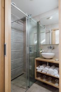 a bathroom with a glass shower and a sink at Gostišče Iršič in Slovenska Bistrica