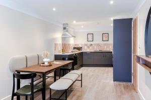 a kitchen and dining room with a table and chairs at Your Apartment I Arabica House in Bristol