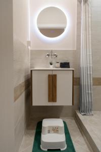 a bathroom with a sink and a toilet at Black Sea Dolphin Apartment in Varna City