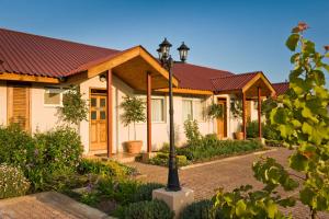 a row of houses with a street light in front at Shakespeare Court Serviced Apartments in Lusaka